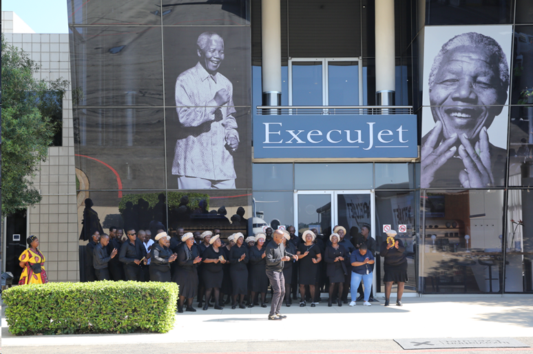 Alex Rhythm of Joy Choir performing for Mandela Day, highlighting Luxaviation's commitment to community service and social responsibility.